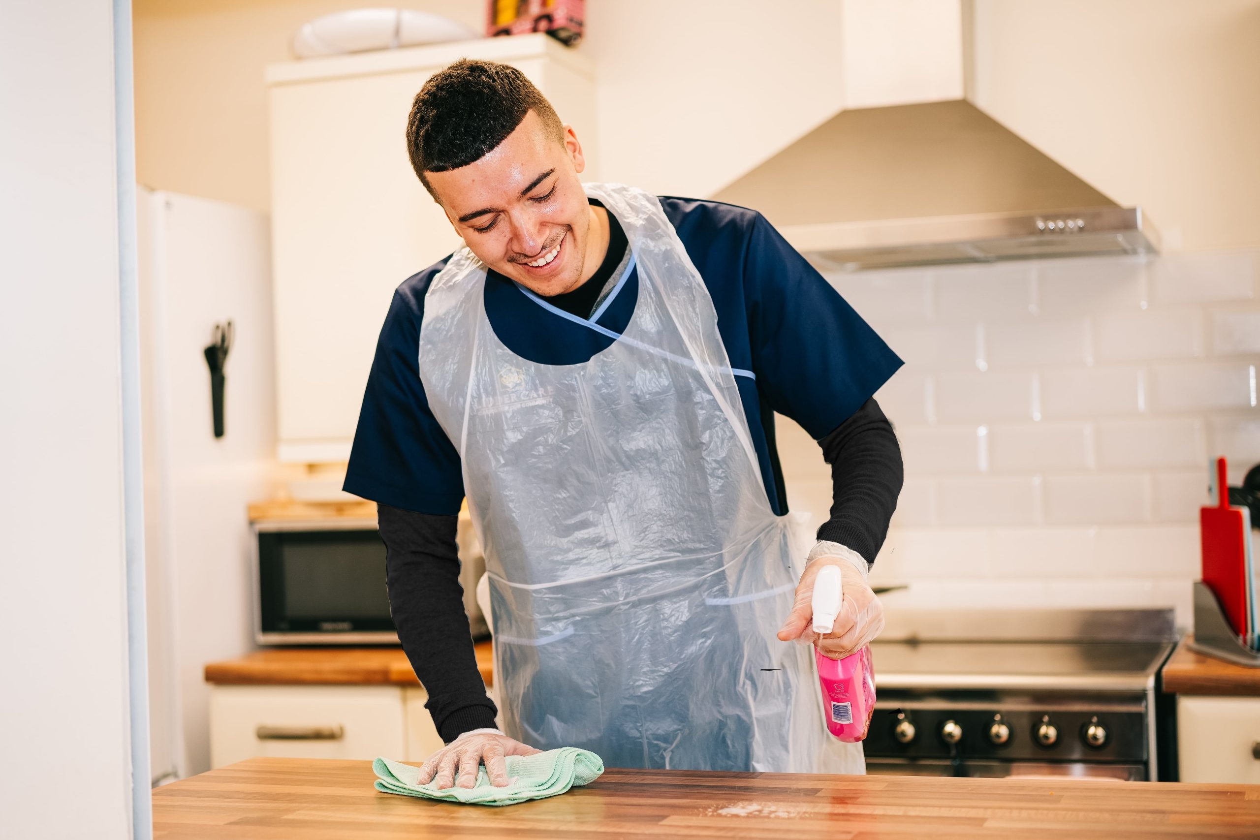 Lidder Home Care carer performing cleaning duties with household tasks support